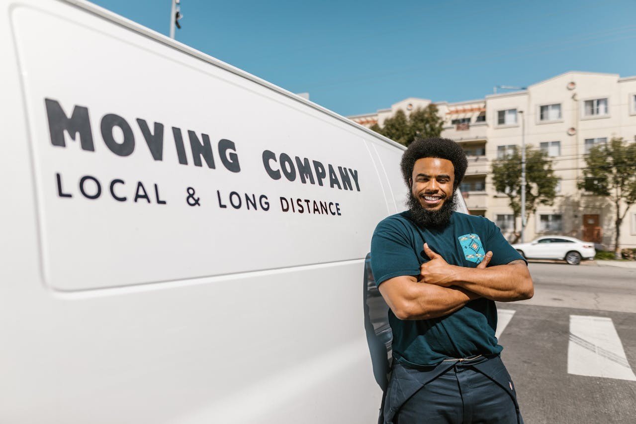 A man standing beside a van.